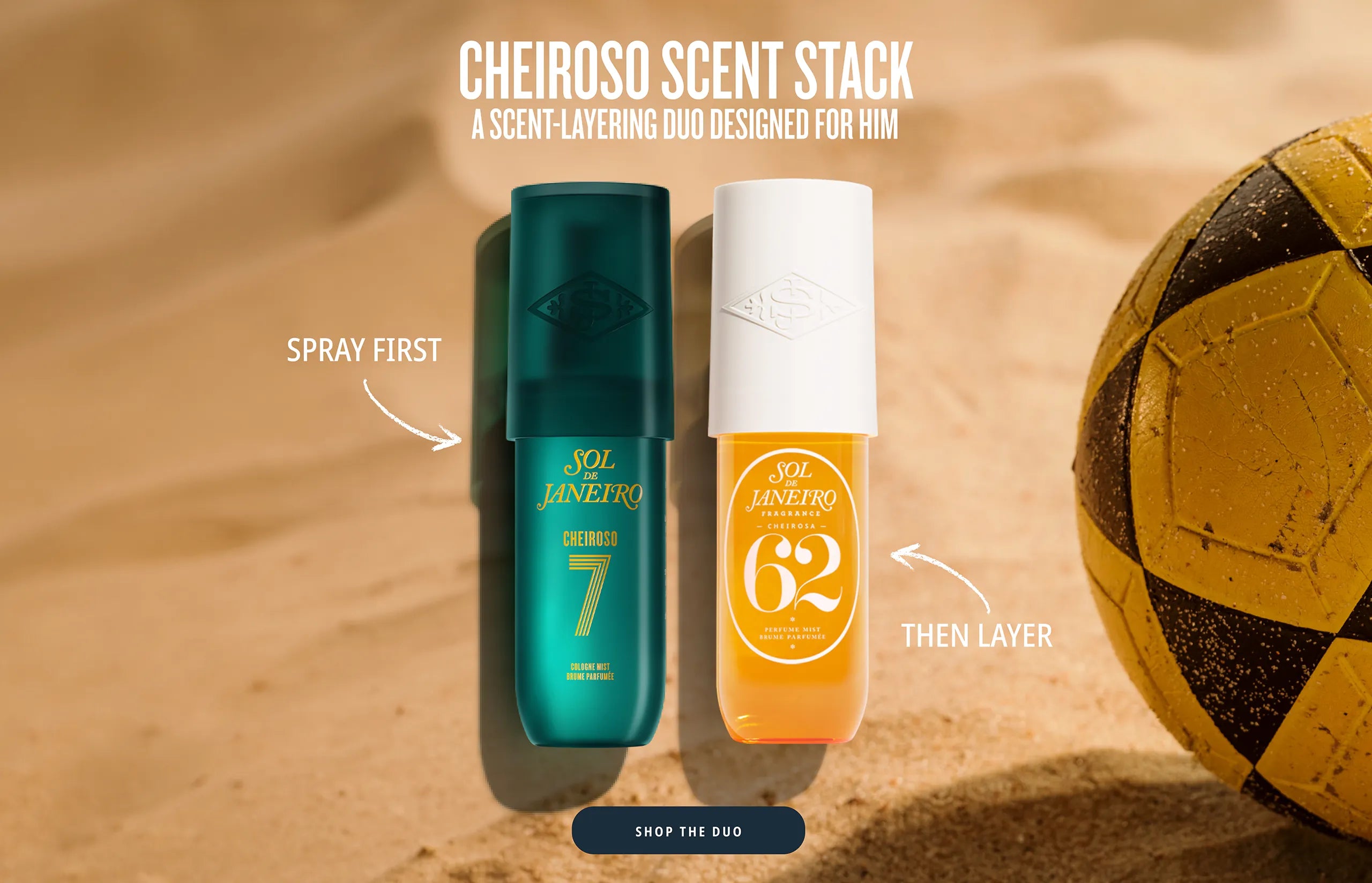 A sandy background featuring a yellow and black soccer ball next to two Sol de Janeiro fragrance bottles. Text at the top reads: 'CHEIROSO SCENT STACK. A SCENT-LAYERING DUO DESIGNED FOR HIM.' An arrow points to the teal Cheiroso 7 bottle with the text 'SPRAY FIRST', and another arrow points to the orange Cheiroso 62 bottle with the text 'THEN LAYER'. A 'SHOP THE DUO' button is at the bottom.